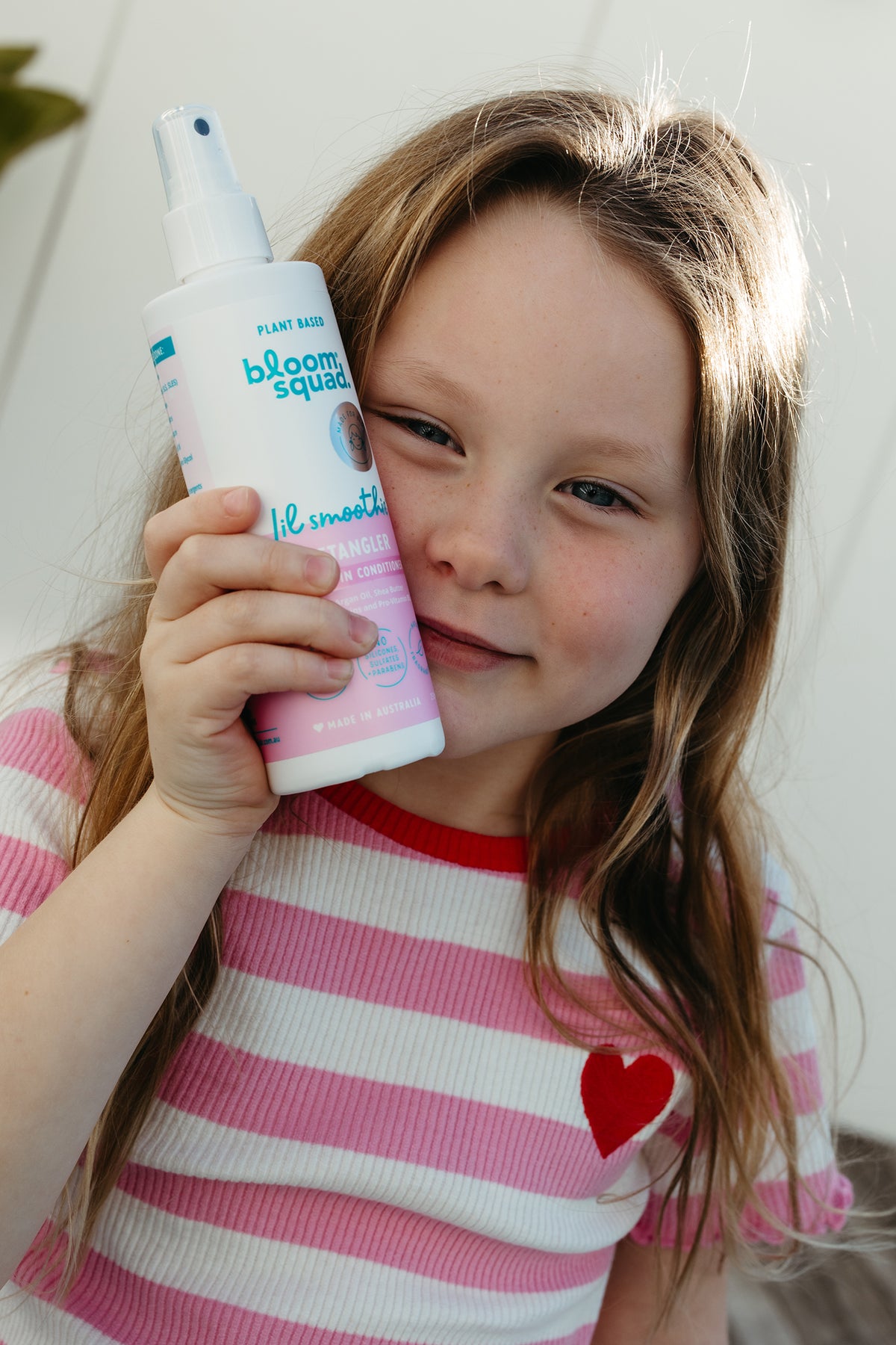 Girl holding detangler