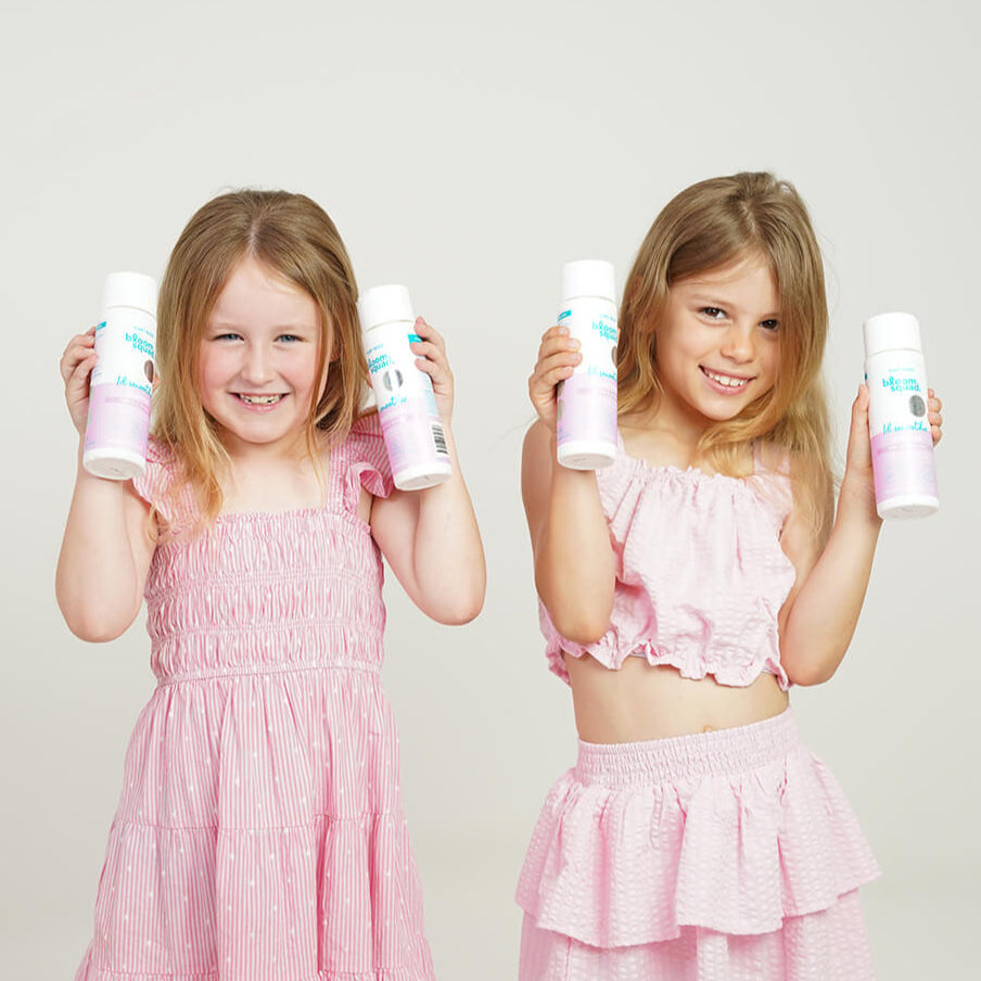Image of 7yr old girls holding Lil Smoothie Shampoo and Conditioner