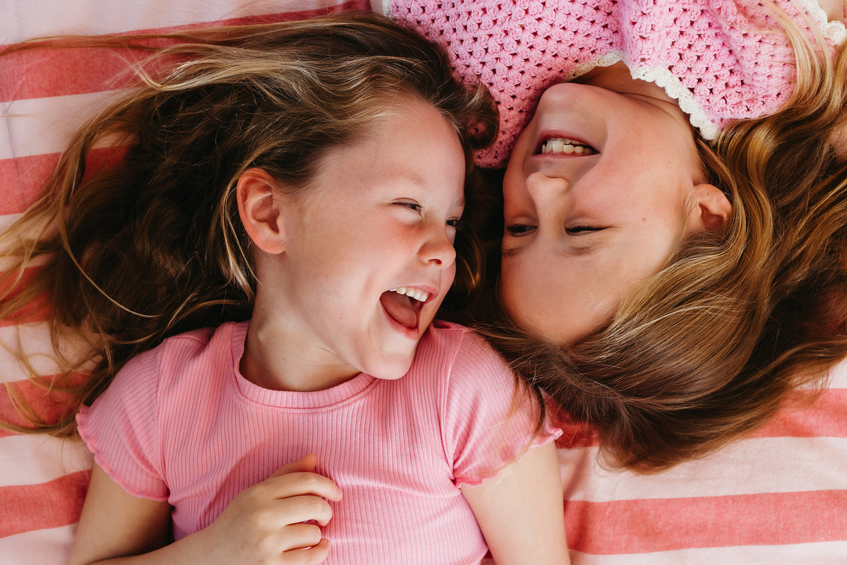Sisters Laughing with pretty hair 